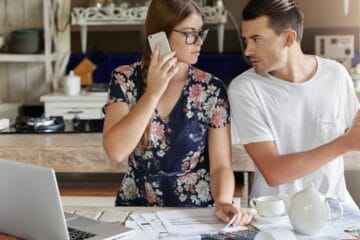 Man & Women trying to Set a Clear Budget for Buying Home Decor