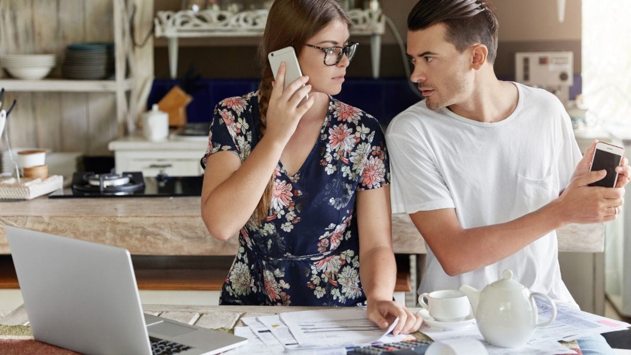 Man & Women trying to Set a Clear Budget for Buying Home Decor