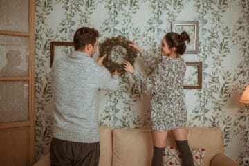 One boy and one girl doing Wall Decor with Fabric