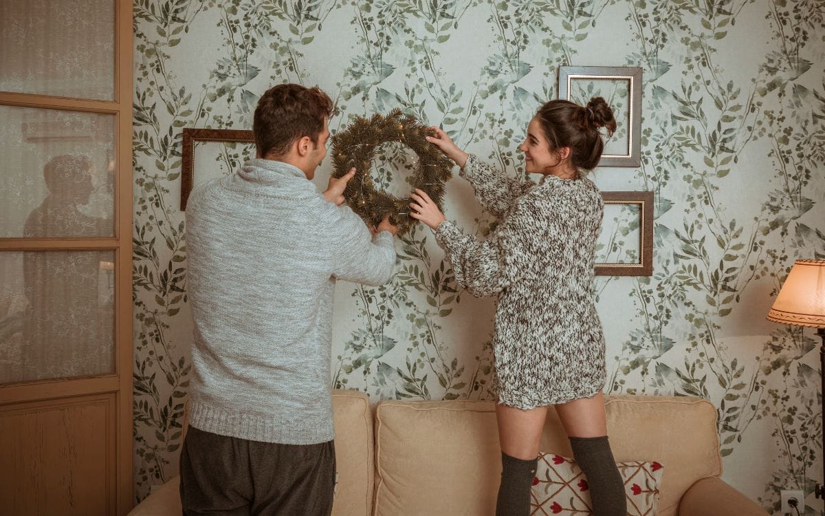 One boy and one girl doing Wall Decor with Fabric